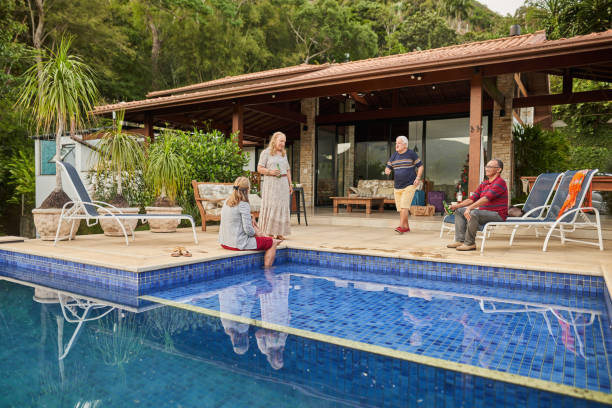 istock Smiling senior friends having drinks together on a patio in summer 1473578193