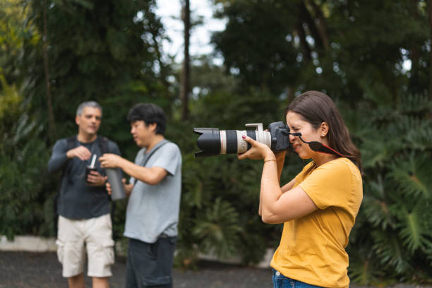 istock Photographers working together outdoors 1473578335