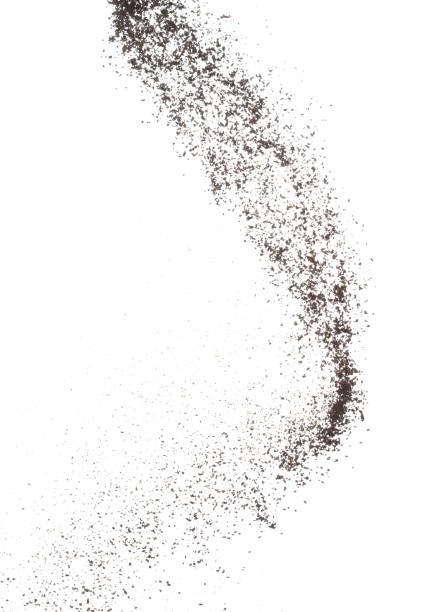 Coffee powder fly explosion, Coffee crushed ground float pouring, wave like smoke smell. Coffee ground powder splash throwing in mid Air. White background Isolated high speed shutter, freeze motion