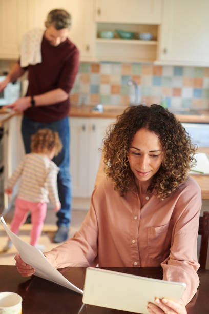 istock mother checking home finances 1473589153