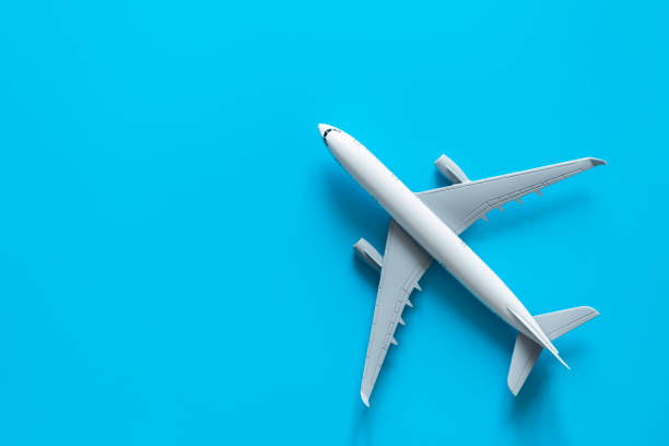 istock Airplane model on a blue background isolated, flat lay. 1473593026