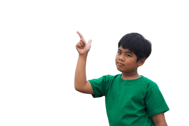 istock The boy smiled and pointed his hand to his side. on a white background 1473597304