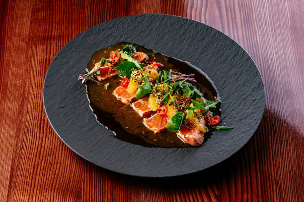 istock salmon carpaccio with sauce and herbs 1473599809