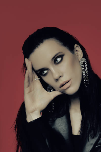 istock Model with Trendy gothic makeup : dark smokey eyes. 1473600410