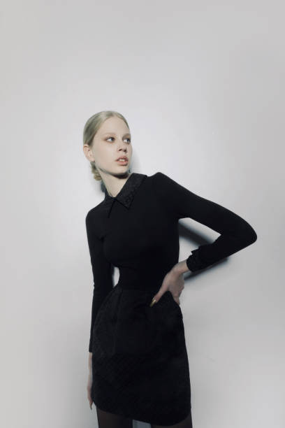 istock Blonde model wearing black dress 1473601076