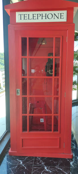 istock a public telephone with a red room box 1473601476