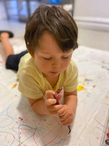 istock Toddler painting 1473603798