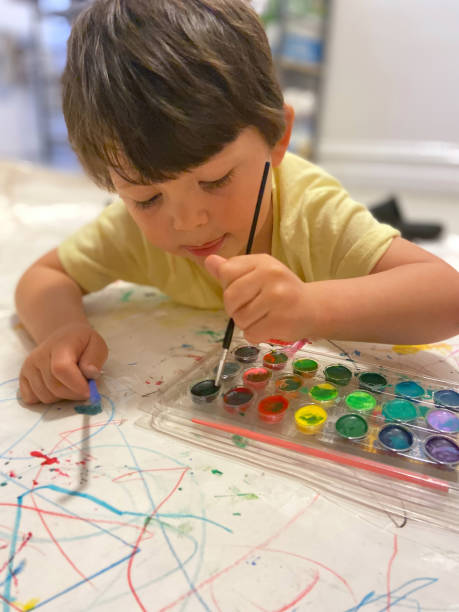 istock Toddler painting 1473603806