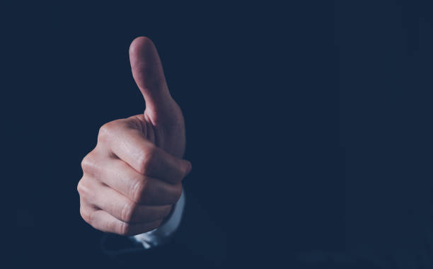 istock thumb up feedback customer services satisfaction concept. businessman giving thumb up with copy space 1473603843