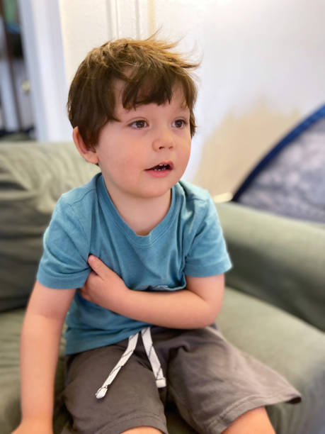 istock Toddler sitting in a sofa at home 1473603878