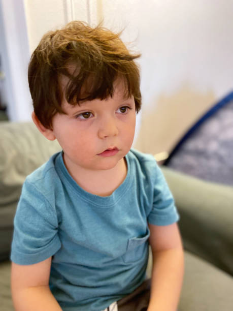 istock Toddler sitting in a sofa at home 1473603883