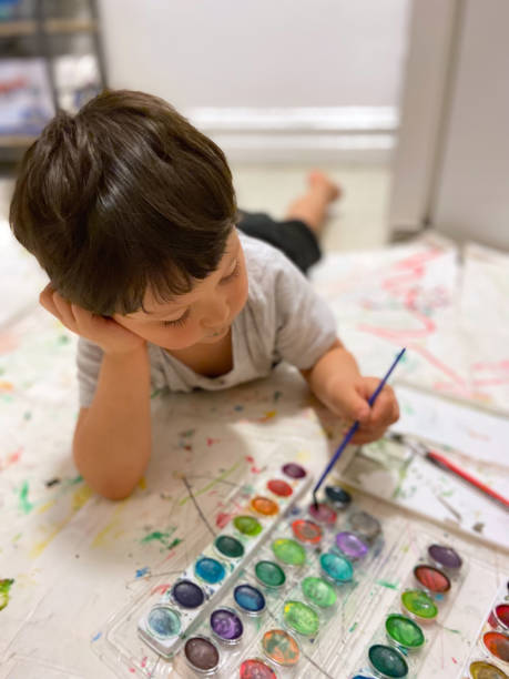 istock Toddler painting with tempera 1473604180