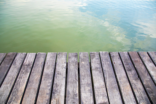 Wooden pier on the lake, background with copy space for text