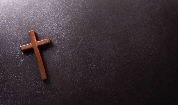 istock Good Friday and Holy week concept - A religious cross on dark stone background. 1473612428