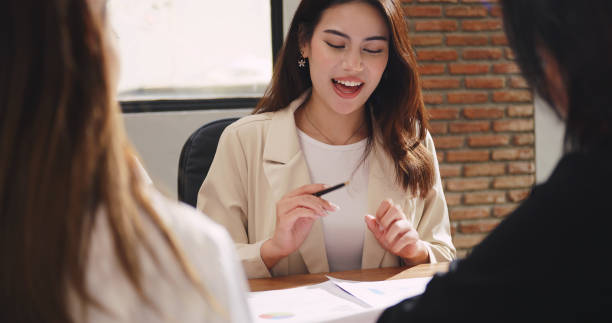 istock Confident businesswoman sharing ideas or explaining work projects to colleagues during corporate team meeting. 1473612473