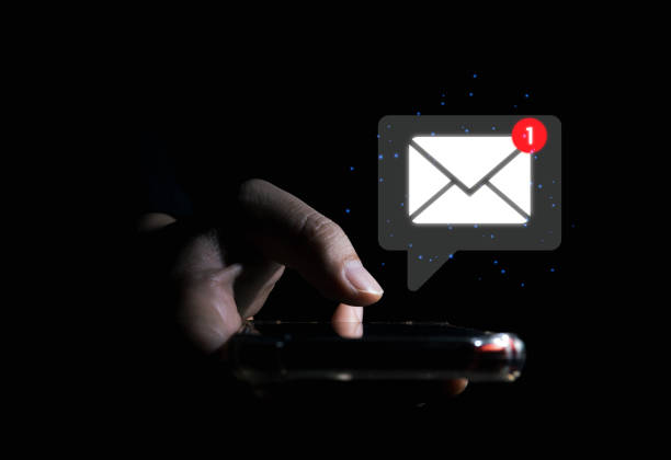 istock businessman holding smartphone touching white e-mail on the virtual screen 1473614880