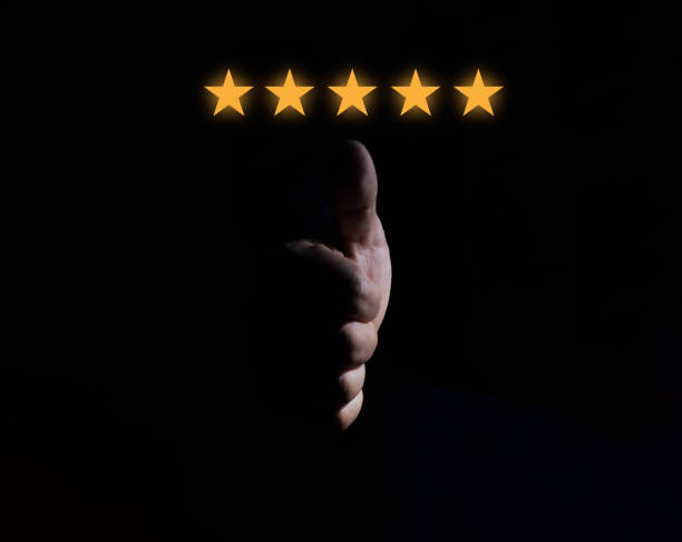 istock customer thumbs up 5 stars very satisfied with service black background 1473615411
