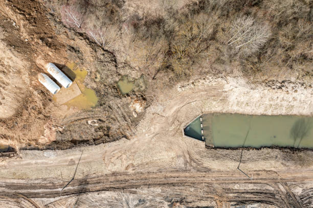istock laying or replacement of underground storm sewer pipes. construction site. aerial top view. 1473615513
