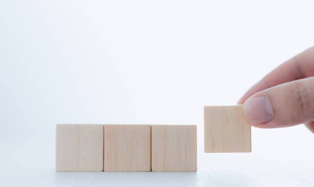 istock Businessman lined up wooden blocks free space to work 1473615744