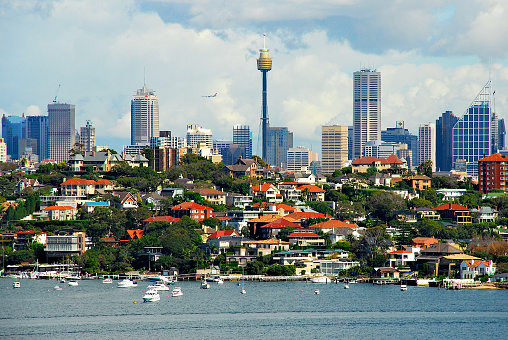 Sydney, New South Wales, Australia - April 8, 2007: The skyscrapers of downtown Sydney are seen in the distance across Rose Bay on a cloudy day.