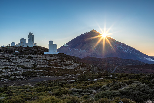Sunset at observatory in front of the summit of Teide mountain, Tenerife, Spain