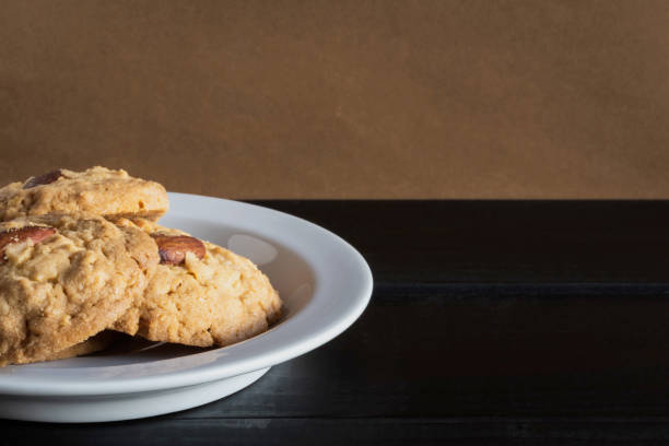 istock Almond and cashew nut cookies on white plate. 1473622767