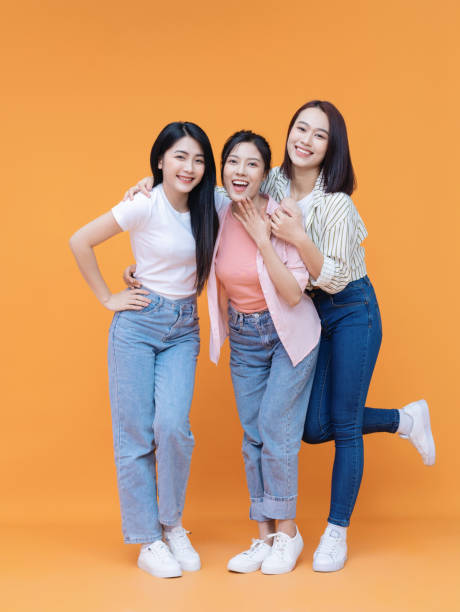 istock Image of young three Asian girl on background 1473623662