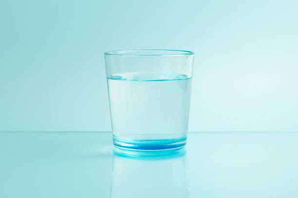 Close-Up Of Water Falling From Bottle