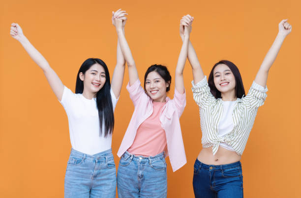 istock Image of young three Asian girl on background 1473623697