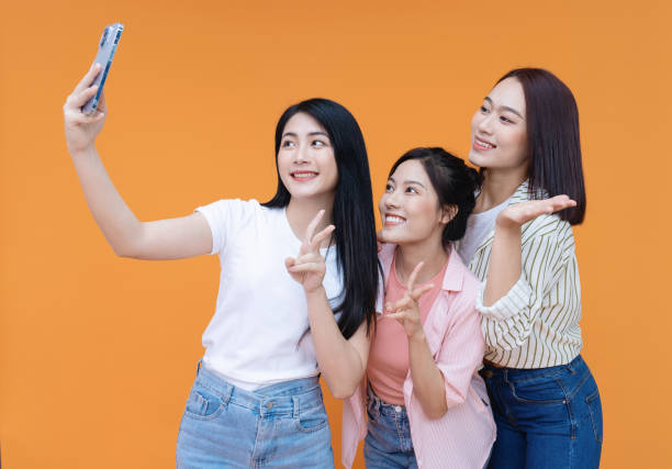 istock Image of young three Asian girl on background 1473623706