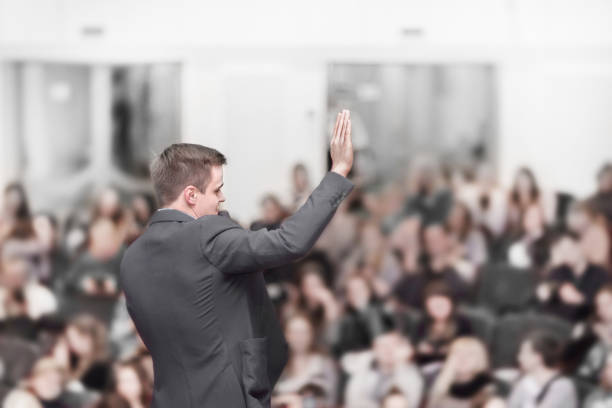 istock Speaker at a business conference with a public report 1473629795