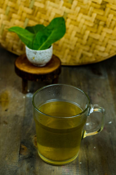 Fresh tea made of bay leaf in a glass on the table. stock photo