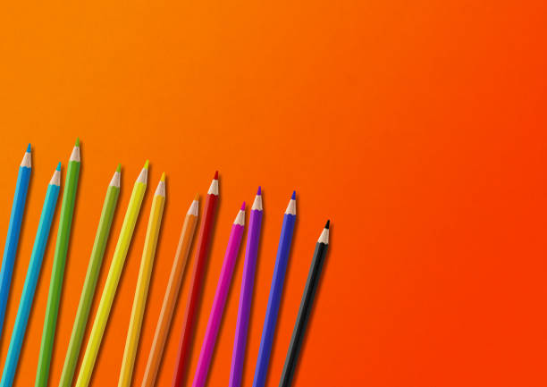 istock Colored pencil group isolated on orange. Horizontal background 1473633560
