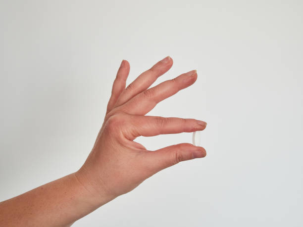 istock Close-up shot of pill in nurse's hand. 1473639180