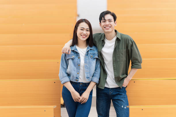 istock Young Asian couple in the classroom 1473639459