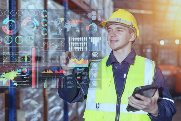 Warehouse worker using hologram visual smart information display for futuristic data business intelligent for Logistics Industry stock photo