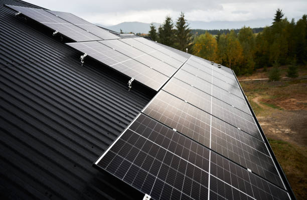 istock Solar photovoltaic batteries on a roof. 1473640806