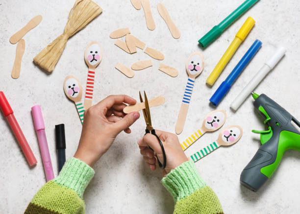 istock Step 6. Cut a wooden spade in half with scissors for making rabbit ears.  Small gift or decor for Easter. 1473646050