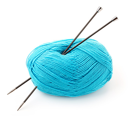 Blue threads and knitting needles isolated on white background