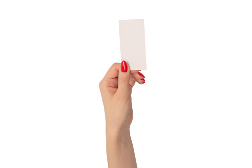 Empty card in woman hand with red nails  isolated on a white background. Copy space.