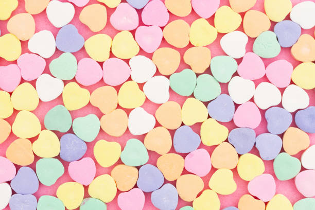 istock Lots of candy hearts love background 1473647059