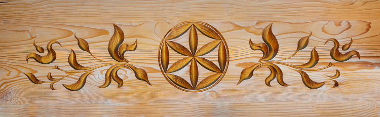 Part of a decorative ornament on a wooden board in traditional Podhale Style olso known as Polish Highlanders Style