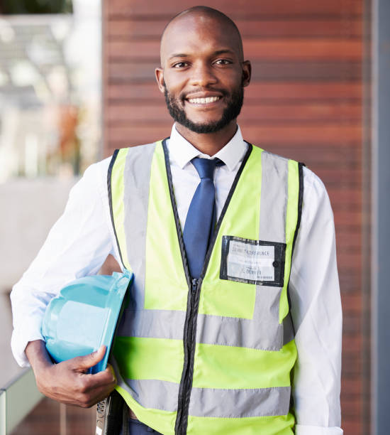 istock Face portrait, black man and construction architect with all access pass for summit conference. Engineer, architecture and happy male contractor, worker or employee holding safety helmet at workshop 1473651488