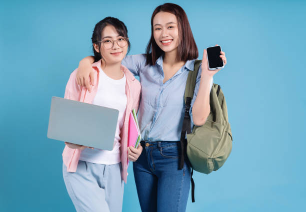 istock Two women on blue background 1473651861