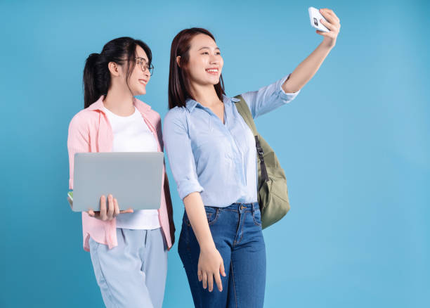 istock Two women on blue background 1473652079