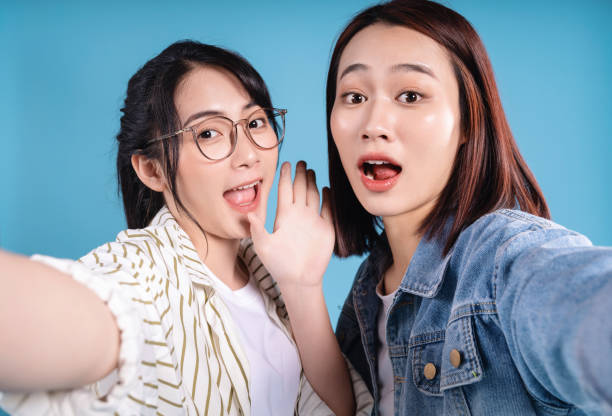 istock Two women on blue background 1473652091