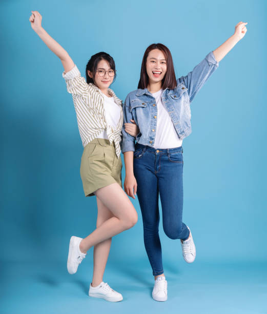 istock Two women on blue background 1473652127