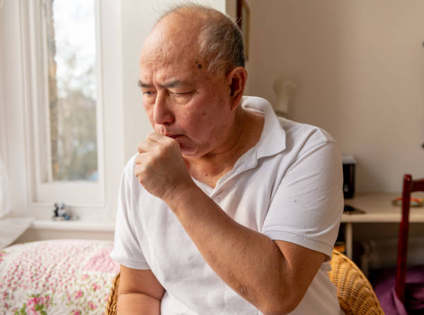 istock Elderly man suffering symptoms of cold and flu. 1473652356