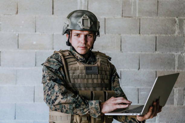 istock American soldier in military uniform using laptop computer for drone controlling and to stay in contact with friends and family 1473654036