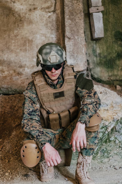 istock Upset soldier has psychological problems holding his head 1473655934